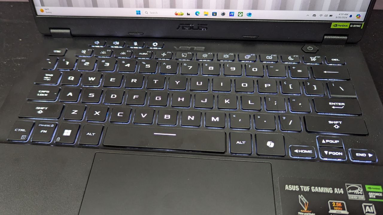 Close-up of Asus TUF Gaming A14 keyboard and touchpad.