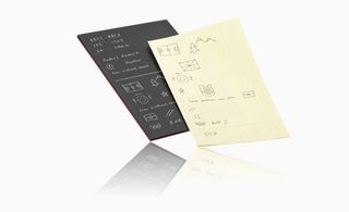 A piece of paper attached to the tablet responds to handwriting