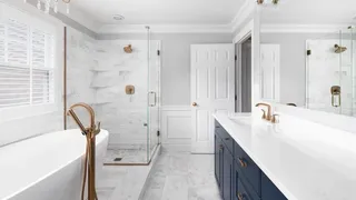 White bathroom with colourful cupboard