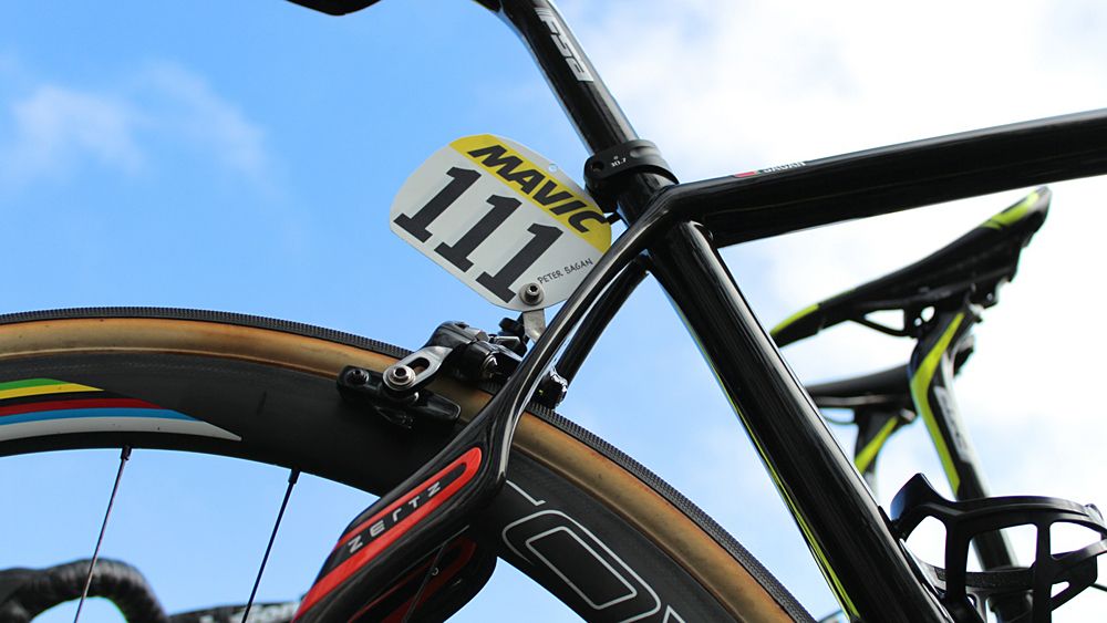 While riders have multiple (and often identical) bikes, they are only issued one race number per event