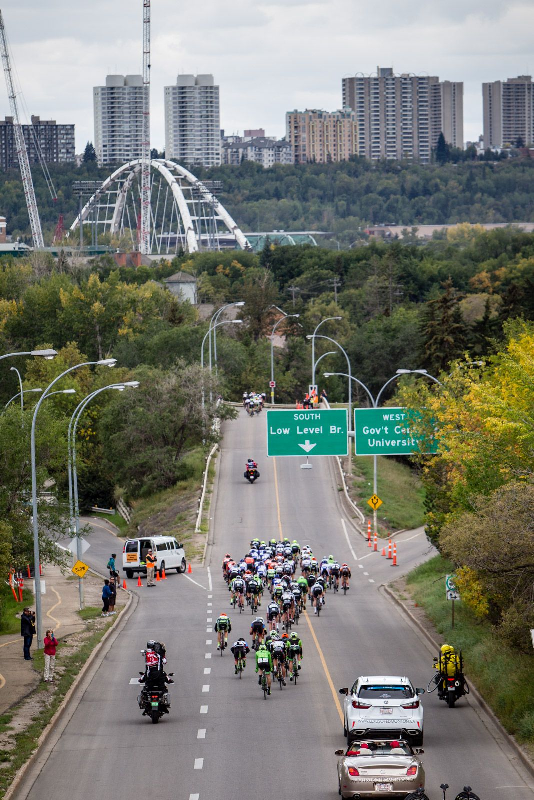 A break gets up the road as the bunch loops back towards downtown.
