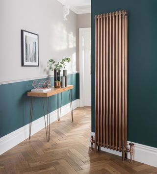 Metallic finish radiator in hallway