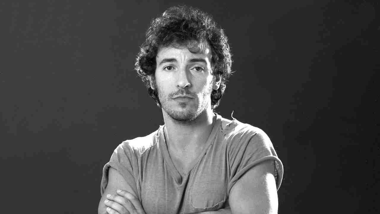 Bruce Springsteen posing for a photograph in 1984