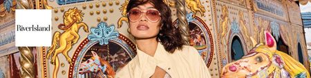 river island logo top left with a wide image of a woman on a carousel 