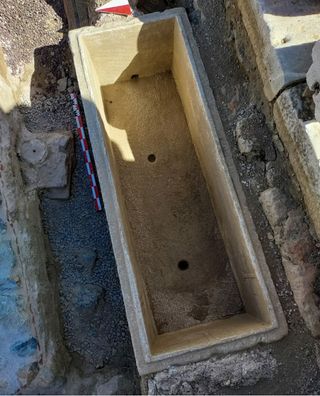 View from the top of a Roman sarcophagus recently unearthed in Turkey. The sarcophagus is empty in the picture.