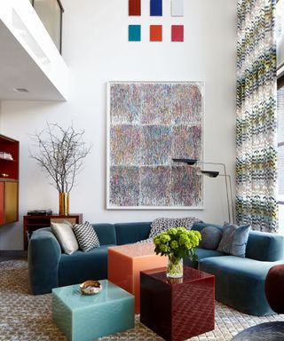 Frampton & Co living space with teal velvet sofa, contemporary coffee tables and large abstract artwork