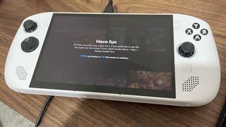 Lenovo Legion Go S with SteamOS installed showing a splash screen that says 'Have fun'