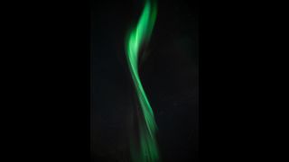 A singular, green aurora.