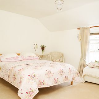 guest bedroom with floral bedspread