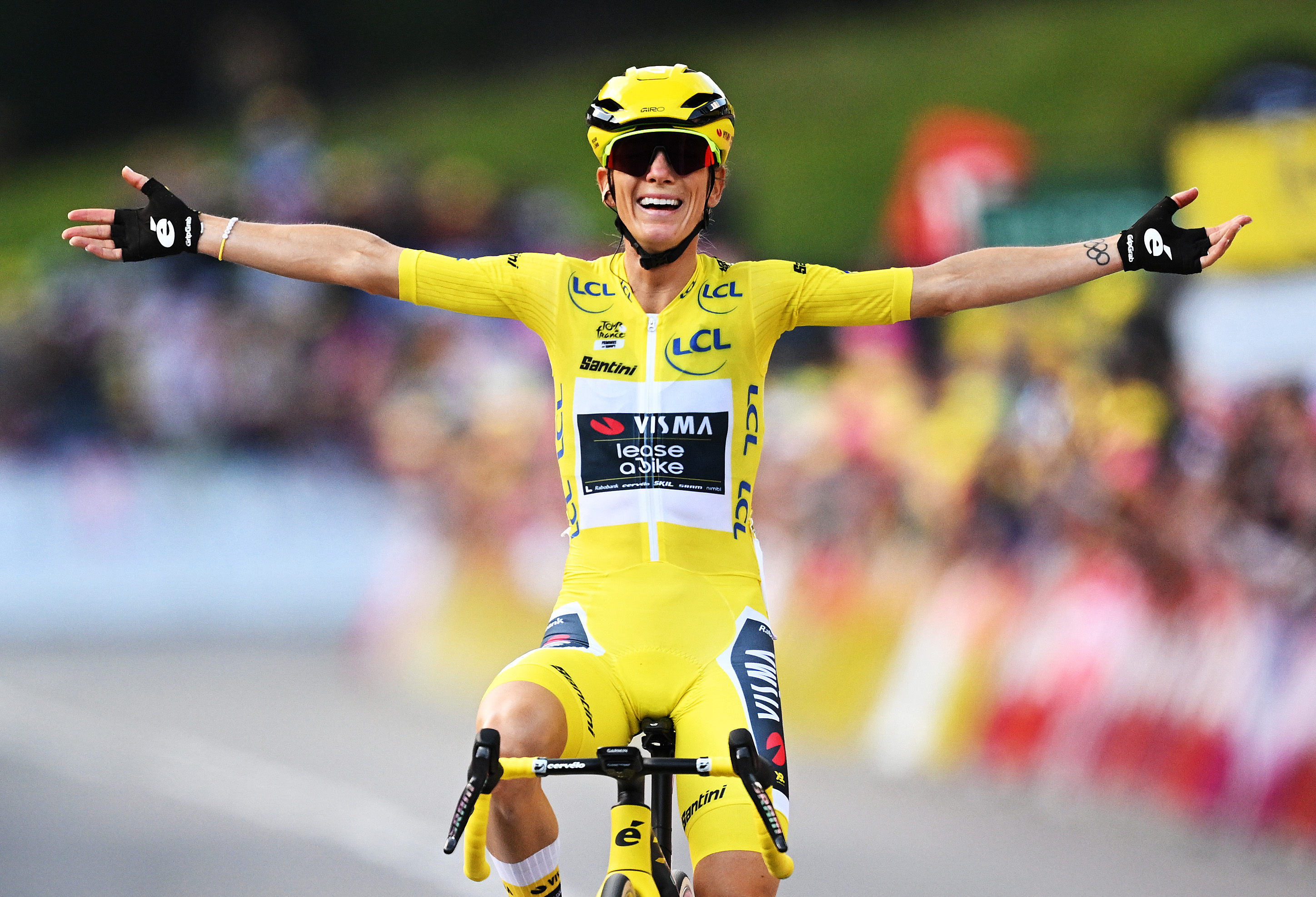Pauline Ferrand-Prevot celebrates in the yellow jersey at the Tour de France Femmes