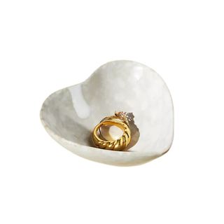 A heart-shaped trinket bowl made of stone