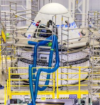 Boeing's second CST-100 Starliner spacecraft undergoes preparations for the Orbital Flight Test-2 (OFT-2) mission in the Commercial Crew and Cargo Processing Facility at NASA’s Kennedy Space Center in Florida on April 28, 2021. The spacecraft is scheduled to launch July 30.