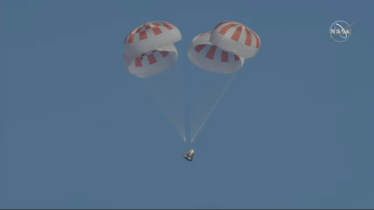 A view of SpaceX's Crew Dragon under its four main parachutes.