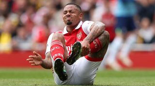 Gabriel Jesus of Arsenal holds his ankle before being treated for an injury during the Premier League match between Arsenal FC and Tottenham Hotspur at Emirates Stadium on October 01, 2022 in London, England. (Photo by Catherine Ivill/Getty Images)