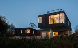 The 6000 sq ft house rises above the difficult FEMA floodplain that it is built on