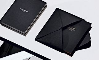 The new Saint Laurent name, it sent out a discreet black notebook as an invitation