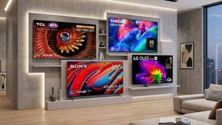 Four TVs mounted on a living room wall.