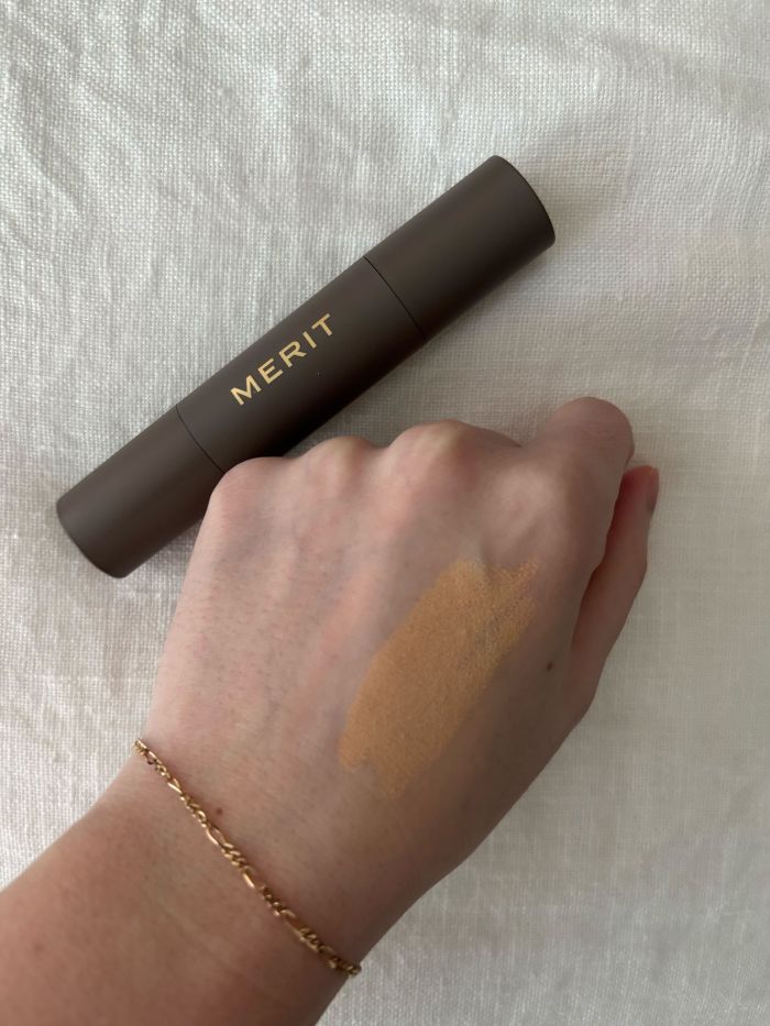 Deputy beauty editor Grace Lindsay testing a Merit concealer on the back of her hand