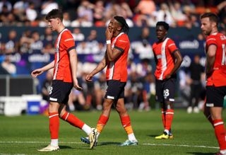 Luton Town players react to conceding a goal against Fulham on the final day of the 2023/24 Premier League season