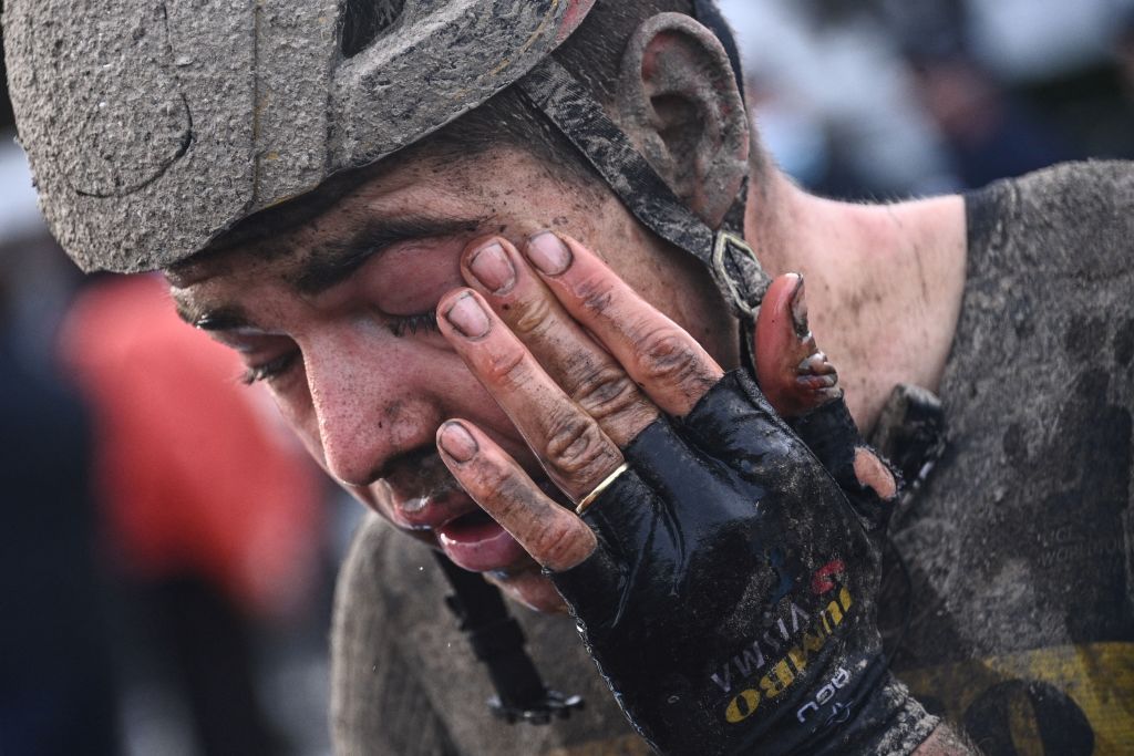Jumbo Visma Wout Van Aert from Bellgium reacts on the finishing area after competing in the 118th edition of the ParisRoubaix oneday classic cycling race between Compiegne and Roubaix in the Velodrome stadium in Roubaix northern France on October 3 2021 Photo by AnneChristine POUJOULAT various sources AFP Photo by ANNECHRISTINE POUJOULATAFP via Getty Images