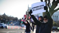 Man protests Elon Musk and Donald Trump government job cuts