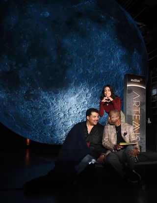 During a moon-lighting ceremony on Thursday (Oct. 3), astrophysicist Neil deGrasse Tyson (left), actress Rosario Dawson (top) and actor LeVar Burton pose for a photo.