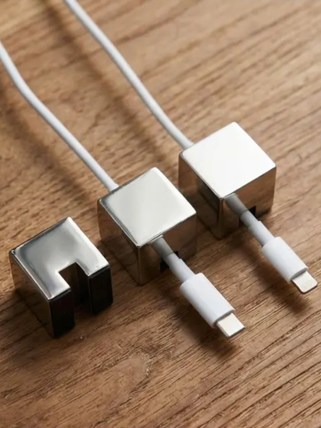 A set of three silver cube cord organizers from Lulucraft Finds