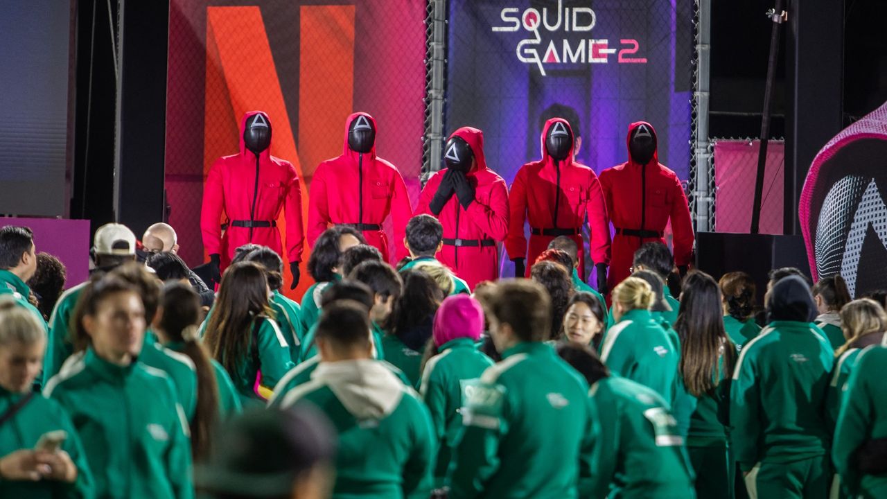 Guests dressed like participants of Squid Games attend the opening ceremony of the Los Angeles premiere and fan event for Netflix&#039;s &quot;Squid Game: Season 2&quot; on December 12, 2024