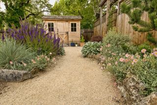 shed ideas: gravel path and traditional shed