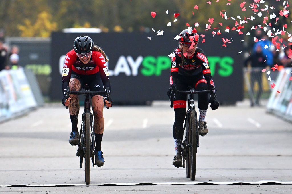 Aniek Van Alphen of The Netherlands and Team 777 celebrates at finish line as race winner ahead of Denise Betsema (Team Pauwels Sauzen Bingoal) in the Superprestige Cyclocross Boom 2022 event