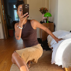 woman wearing brown tank top summer outfit 2025