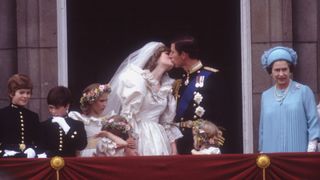 Prince Charles and Princess Diana kissing on their wedding day