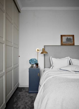 Grey bedroom with built in wardrobe