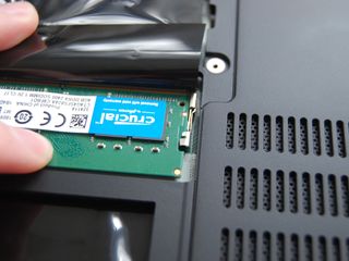 Press down on the RAM until it clicks into place
