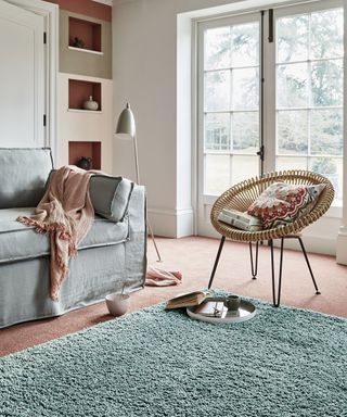 a living room with paint feature wall and Carpetright Dynasty Twist Plain Carpet in Light Pink - carpetright