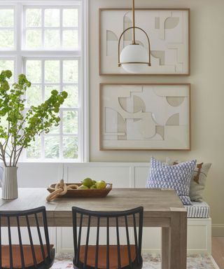 dining space with wooden table and fresh flowers