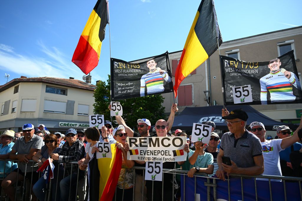 NEULISE FRANCE JUNE 05 Fans of stage winner Remco Evenepoel of Belgium and Team Soudal QuickStep celebrate at podium during the 76th Criterium du Dauphine 2024 Stage 4 a 344km individual time trial at stage from SaintGermainLaval to Neulise 552m UCIWT on June 05 2024 in Neulise France Photo by Dario BelingheriGetty Images