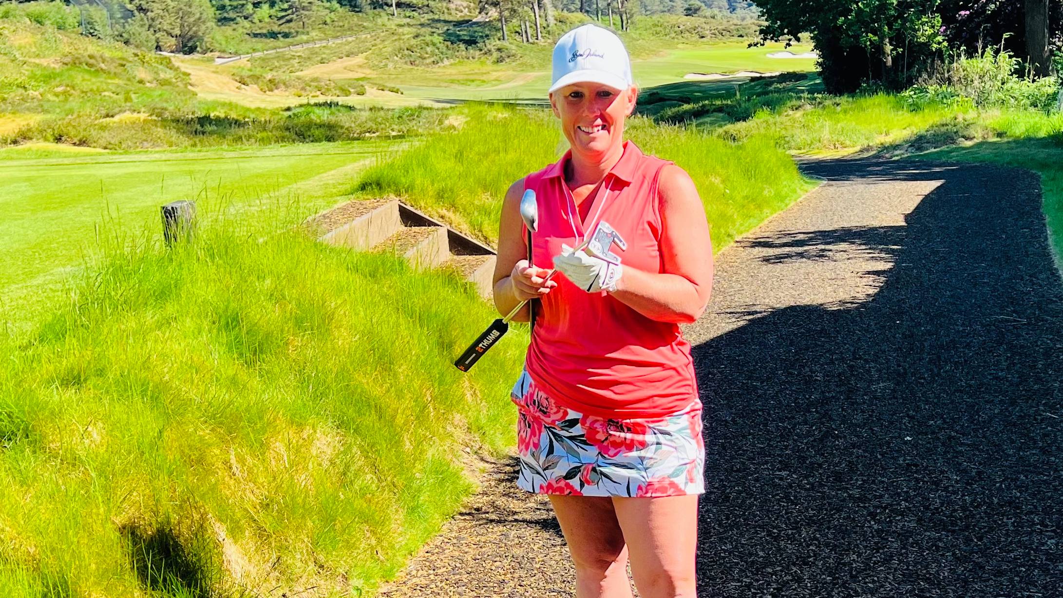 Carly Cummins with a 7-iron and a putter