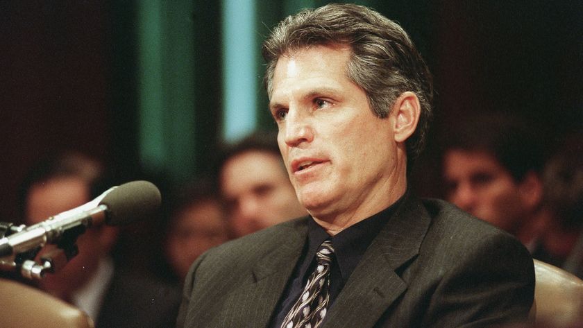 Paul Gelsinger speaks into a microphone