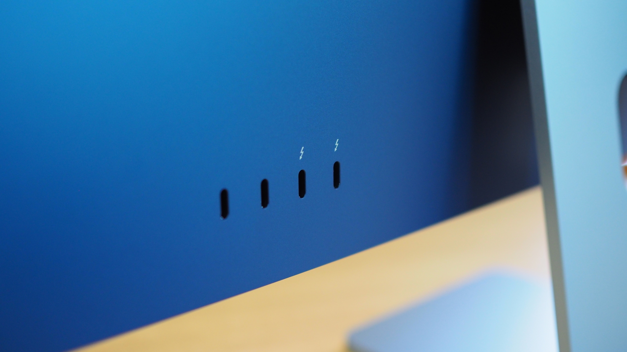 USB-C and Thunderbolt port s on back of blue iMac (2021)