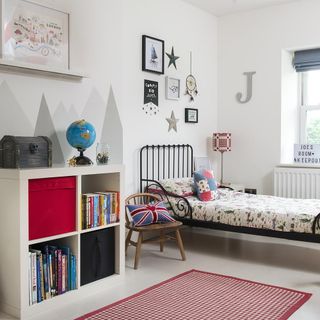 kids bedroom with bright white walls and white book shelves