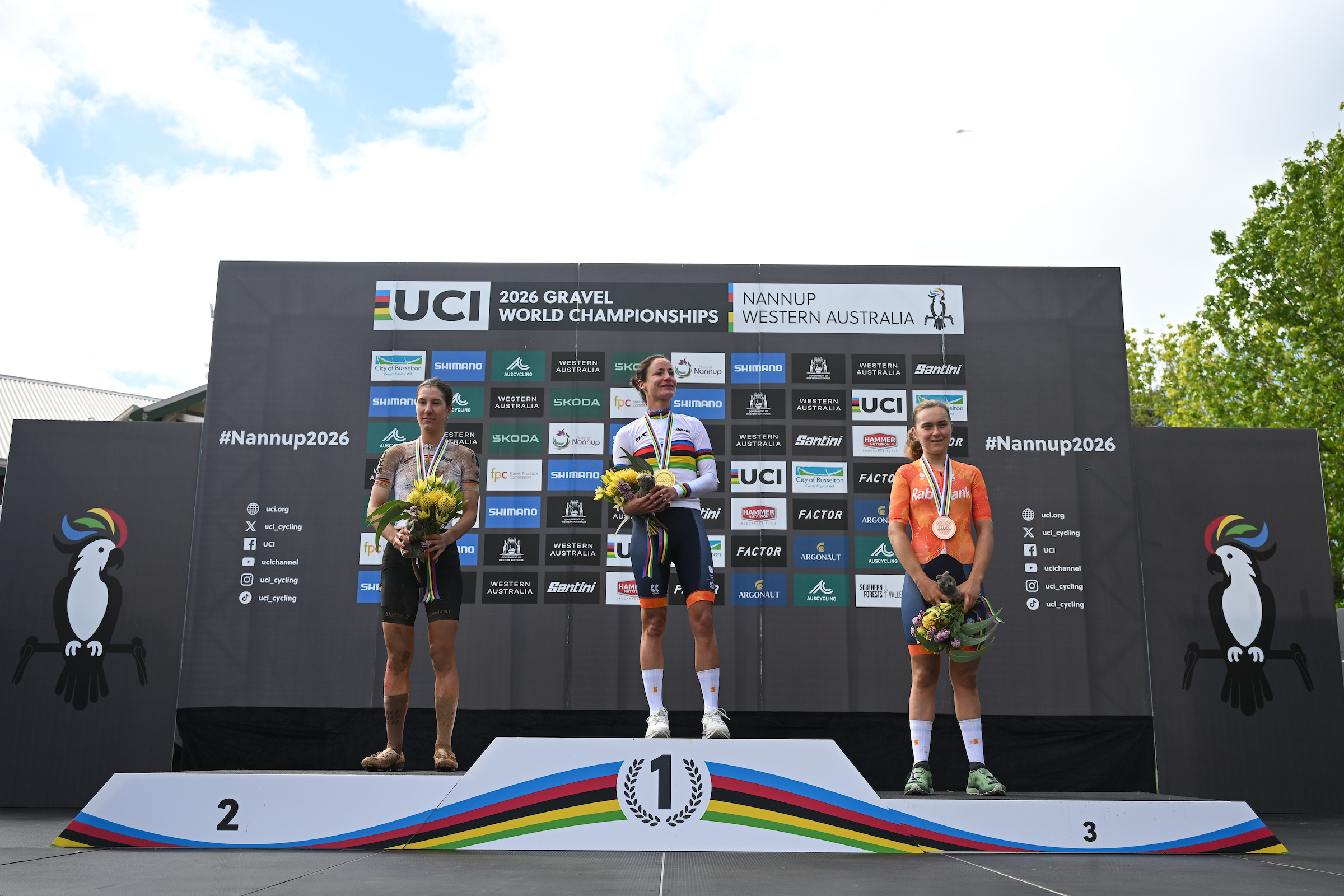 Picture by Zac Williams/SWpix.com - 10/10/2026 - Cycling - 2026 UCI Gravel World Championships - Nannup, Western Australia, Australia - Women&amp;rsquo;s Elite Podium - Marianne Vos (Netherlands) wins the Gold Medal to become World Champion with Rosa Kl&amp;ouml;ser (Germany) receiving the Silver Medal and Larissa Hartog (Netherlands) receiving the Bronze Medal