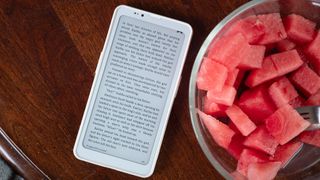 Google Play Books on a Bigme HiBreak Pro next to a bowl of watermelon
