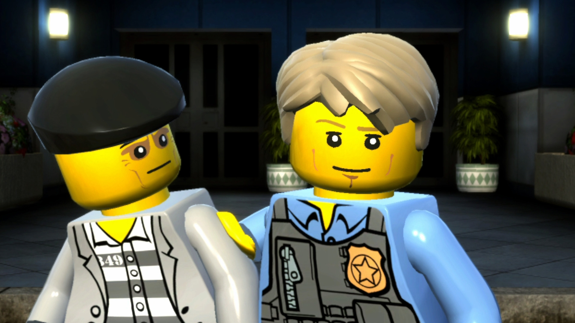 A screenshot of Chase McCain holding a criminal during one of the best Lego games, Lego City Undercover.