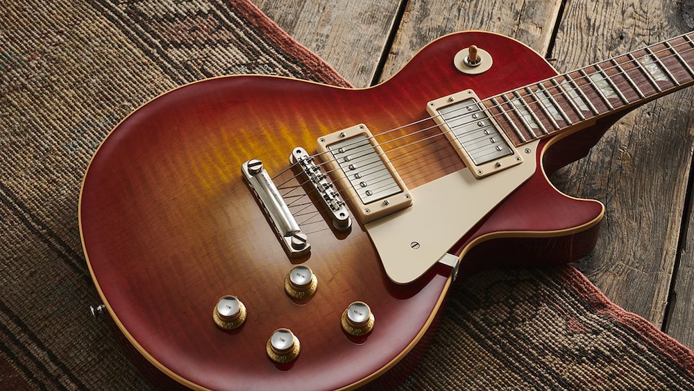 A Gibson Les Paul lying on a rug