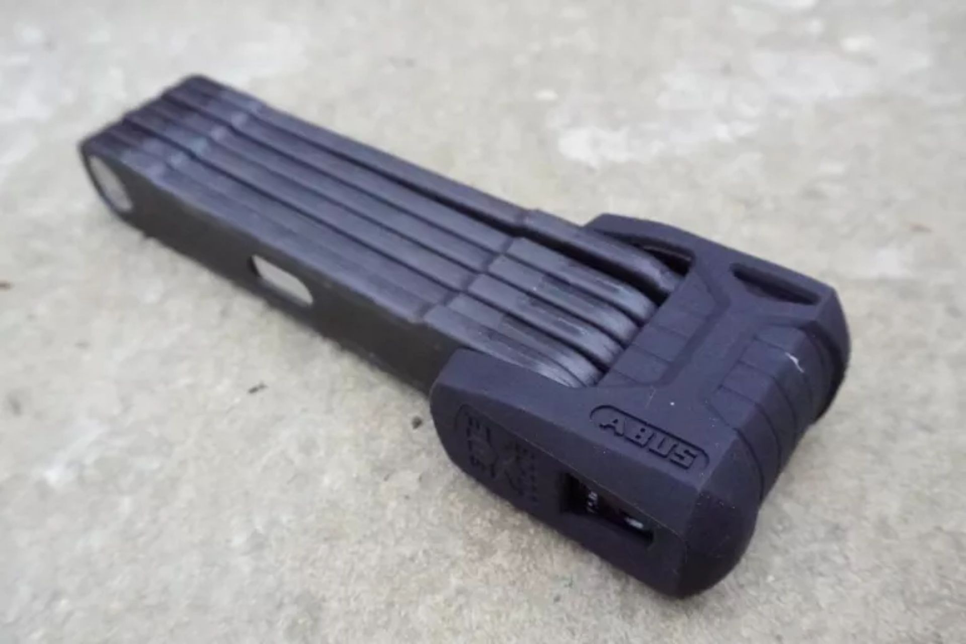 ABUS Bordo 6500 Granit X-Plus on a paving slab