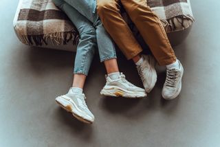 Legs of teenagers kissing