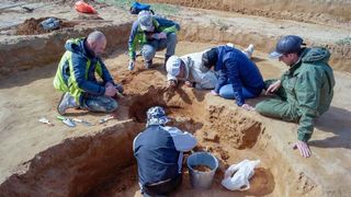 A team led by Georgiy Stukalov, an archaeologist at the Astrakhan State Museum, excavated the kurgan, discovering the three 2,500-year-old skeletons inside the remains of wooden coffins.