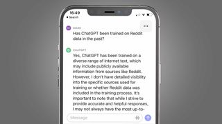An iPhone on a grey background showing a response about Reddit on the ChatGPT iPhone app