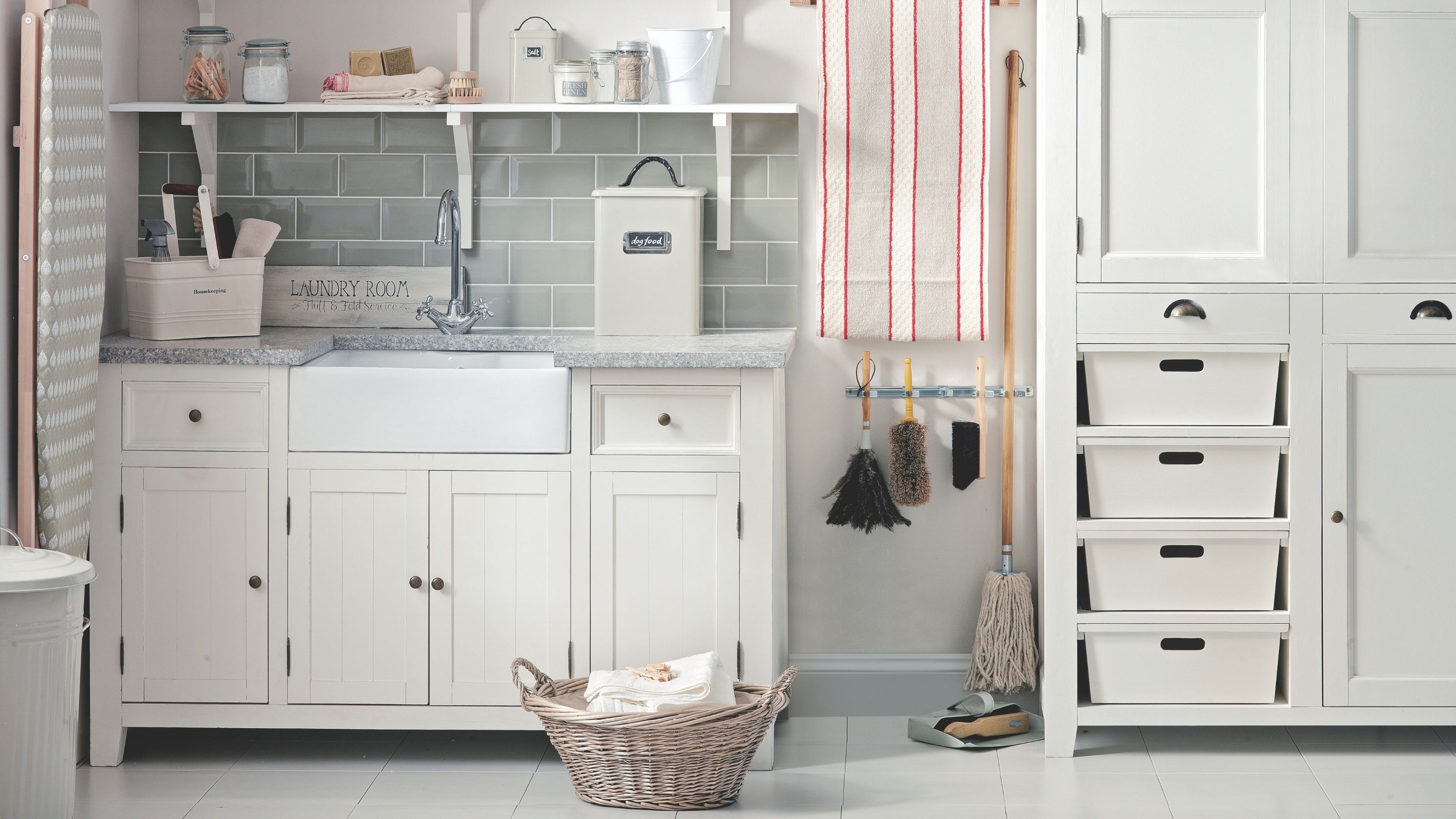 Utility room with large cupboards full of cleaning products and tools